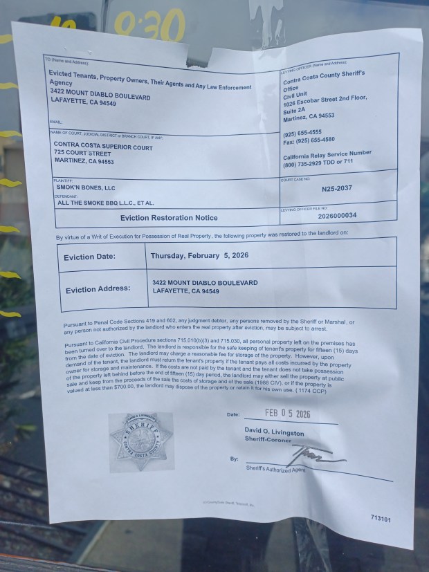 Evictions notices from the Contra Costa Sheriff's Department were taped to the front door of Horn Barbecue on Mount Diablo Boulevard in Lafayette. (Martha Ross/Bay Area News Group)