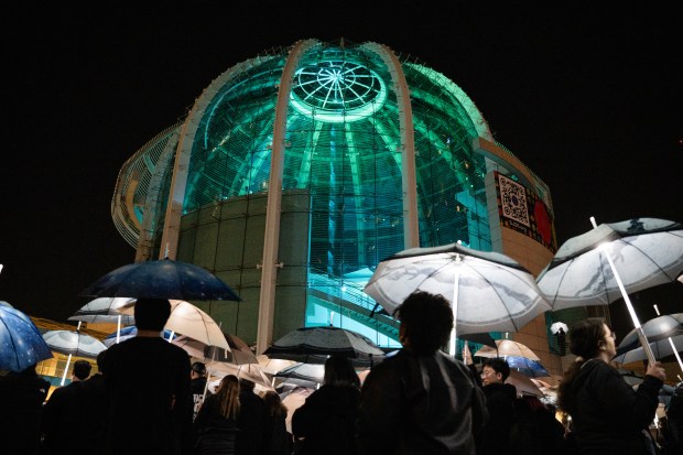 A general view of the Rotunda as participants march with umbrellas printed with aerial photographs at City Hall in San Jose, Calif., on Saturday, Jan. 31, 2026. (Thien-An Truong for Bay Area News Group)