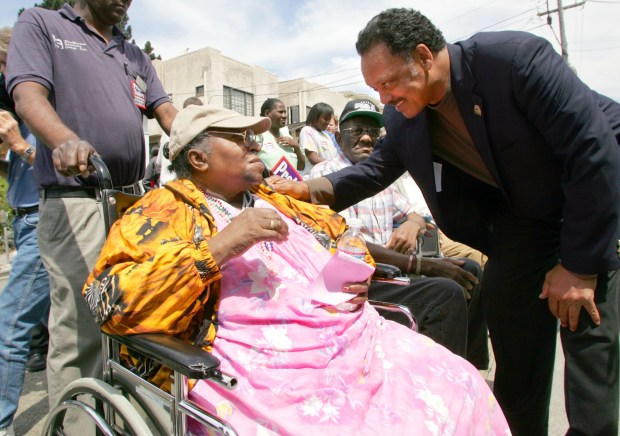 In August of 2004, Rev. Jesse Jackson greets  Beatrice Garrett, 83, at McClure Convalescent Hospital in Oakland where they held a rally in protest to nursing home cuts. (Nick Lammers/ Oakland Tribune Archives)