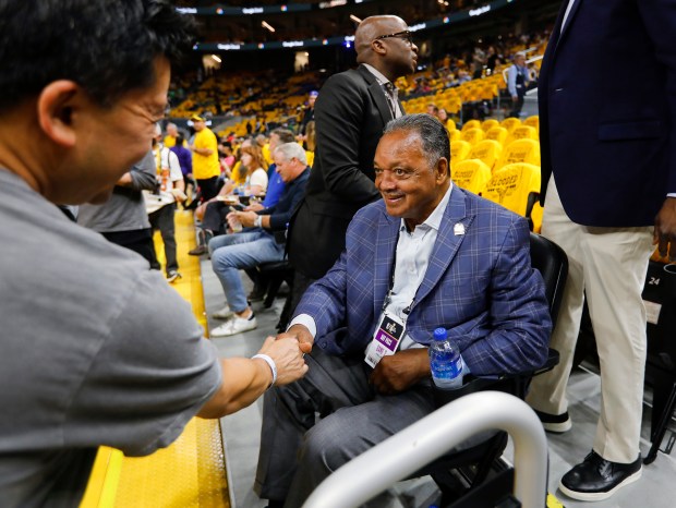 Rev. Jesse Jackson, Sr., shakes hands before the Golden State Warriors game against the Boston Celtics for Game 2 of the NBA Finals at the Chase Center in San Francisco, Calif., on Sunday, June 5, 2022. (Nhat V. Meyer/Bay Area News Group)