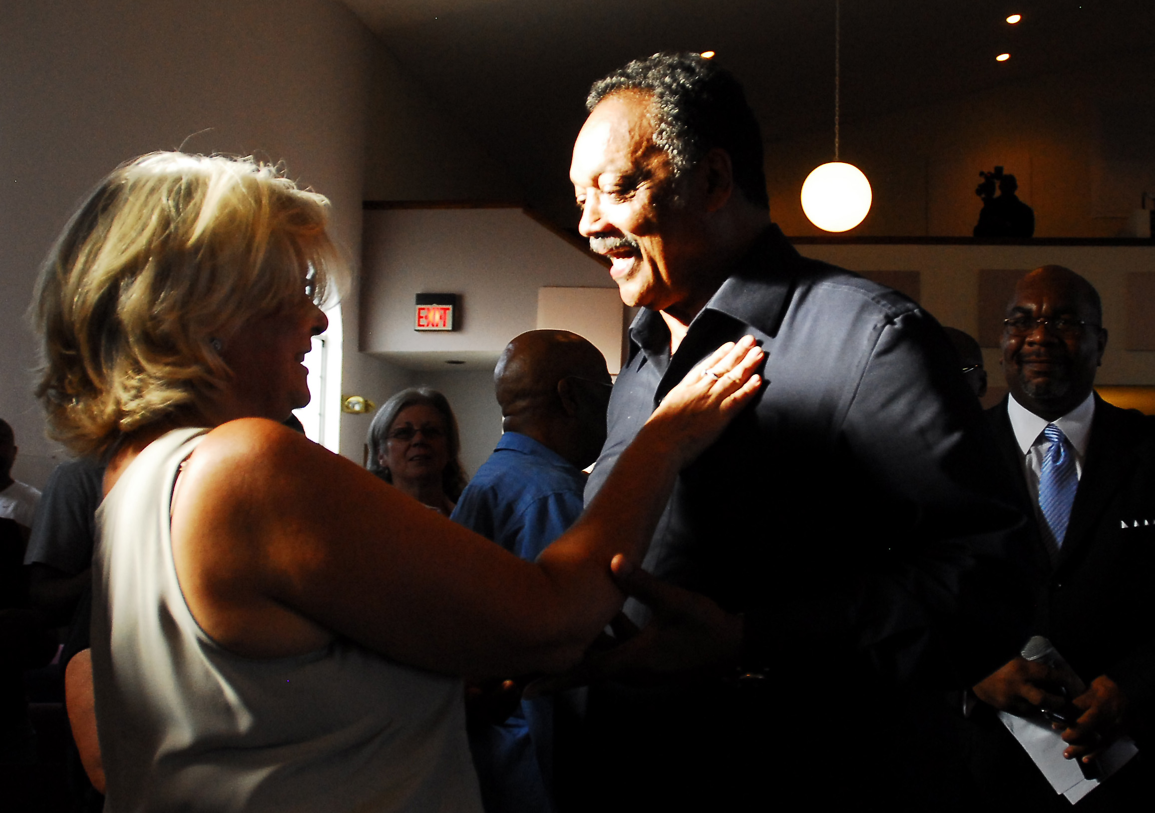 Carole Travis of Pleasant Hill grees the Rev. Jeese Jackson...