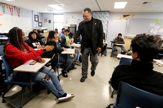 Civil rights leader Rev. Jesse Jackson greets students during the student leadership class at Oakland High School in Oakland, Calif., on Friday, Nov. 30, 2018. Jackson spoke on civil rights and encouraged students to register to vote. (Ray Chavez/Bay Area News Group)