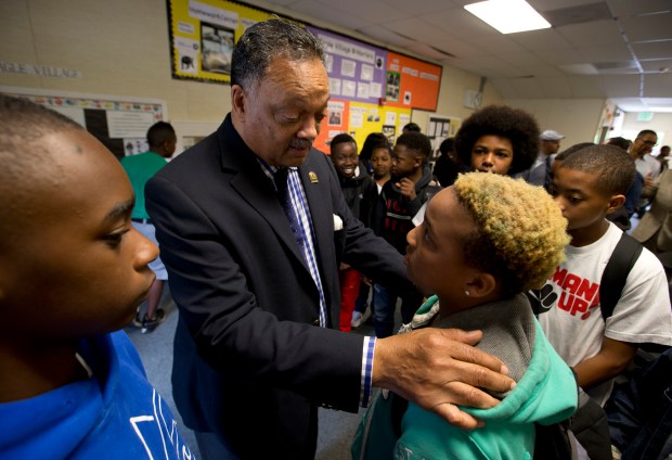 Rev. Jesse Jackson, second from left, speaks to 13-year-old 8th grader Anthony Johnson, as the noted civil rights leader visited the African American Male Achievement Manhood Development Class at Montera Middle School, Thursday, April 21, 2016, in Oakland, Calif. Jackson is in the Bay Area for the PUSHTech2020 Summit, to attempt to forge partnerships with area tech companies and work toward more diversity among their workforce. (D. Ross Cameron/Bay Area News Group)