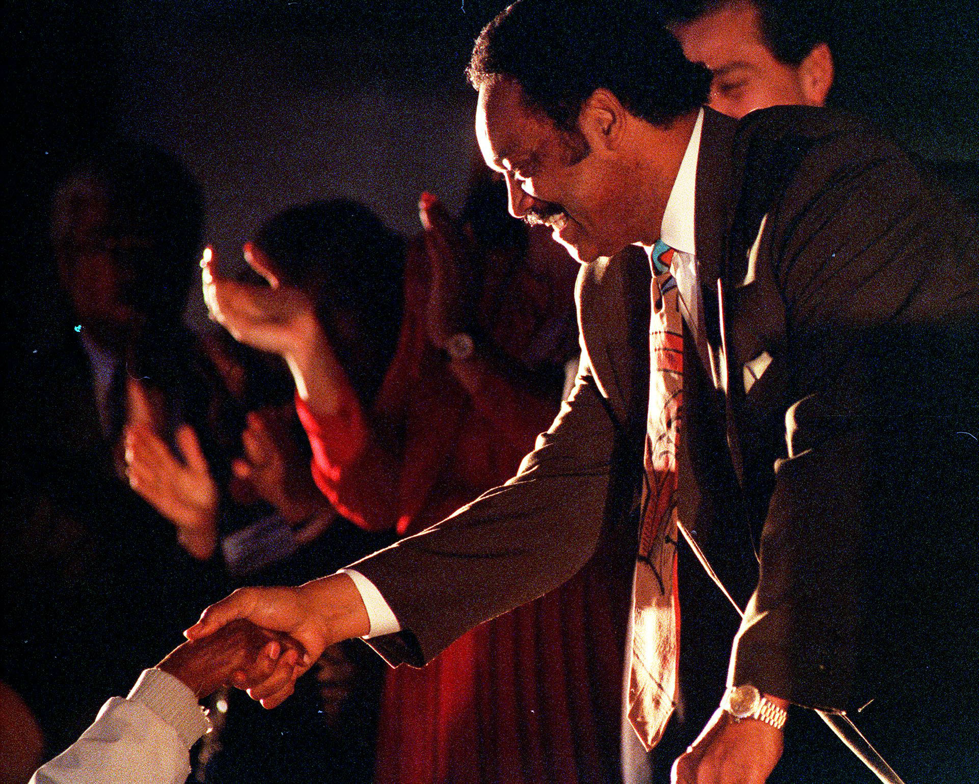 One of more than 1,000 educators welcomes the Rev. Jesse...