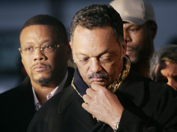 From left, Judge Joe Mathis, Jesse Jackson, and Dwayne Brooks of Oakland retreat from interviews during a brief moment of silence outside the gates of San Quentin on the eve of the execution of Stanley Tookie Williams, 51, on December 12, 2005. Williams, co-founder of the Crips gang, was convicted of four murders in 1979 and sentenced to death by lethal injection. After 24 years in San Quentin and a denial of clemency by Governor Arnold Schwarzenegger on December 12, 2005. (Anne-Marie McReynolds/ Mercury News Archives)