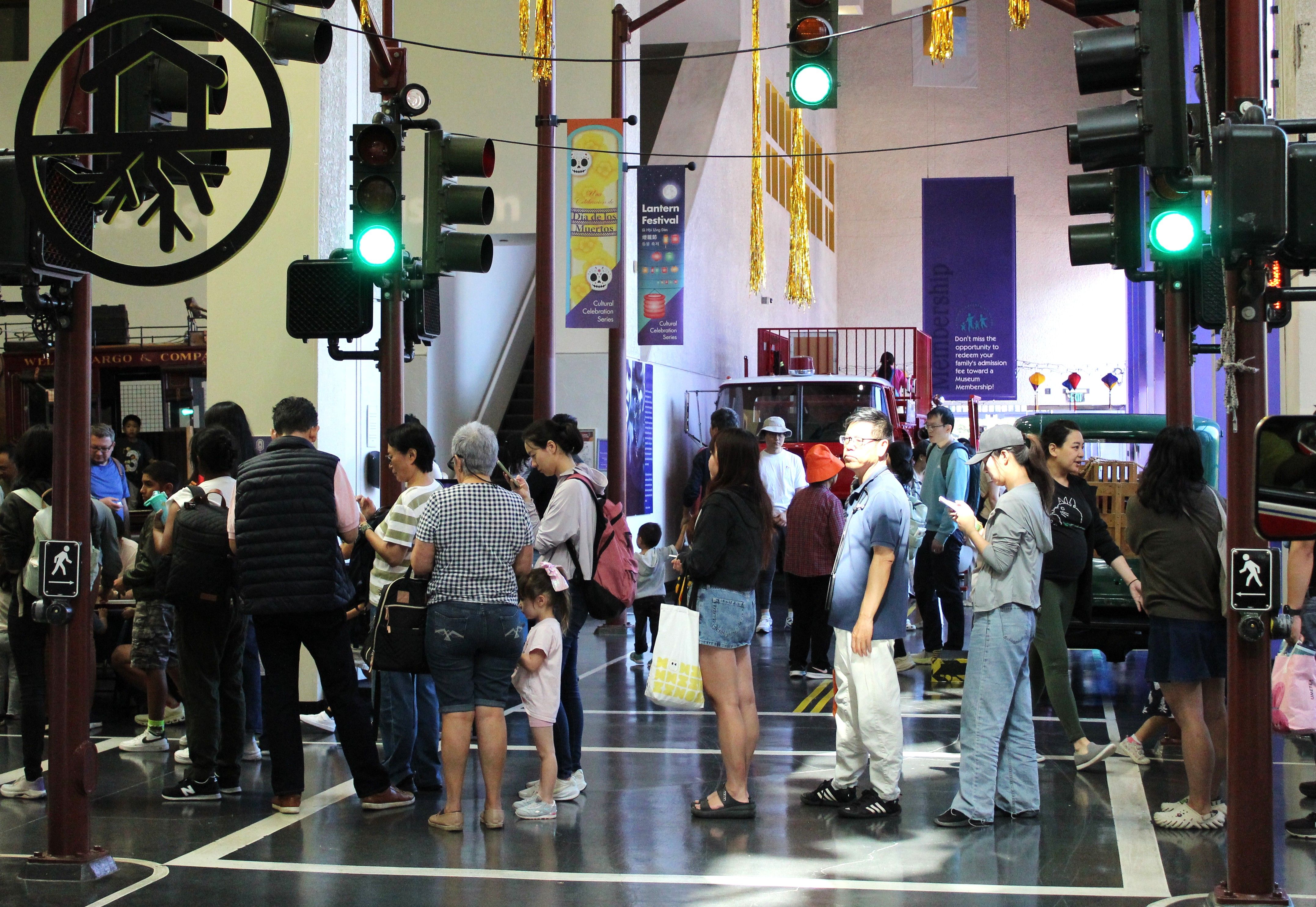 Lion dancers roam through the large crowd gathered for the...
