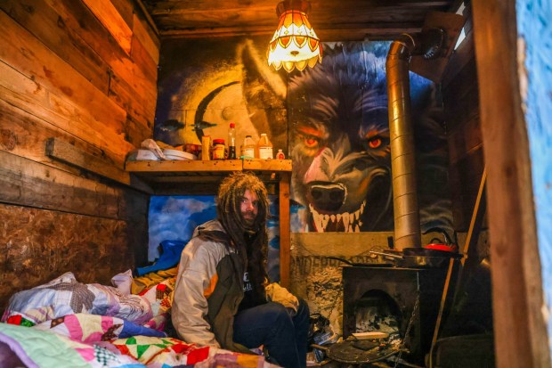 Jeffrey Clark, who is homeless, sits in his makeshift shelter within a homeless encampment at Pine and Guss streets in Oakland, Calif., on Tuesday, Jan. 6, 2026. (Ray Chavez/Bay Area News Group)