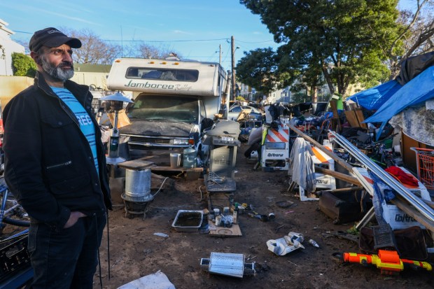 Masoud Saberi, who is homeless, looks on while standing next to his RV at the homeless encampment at Pine and Guss streets in Oakland, Calif., on Tuesday, Jan. 6, 2026. (Ray Chavez/Bay Area News Group)