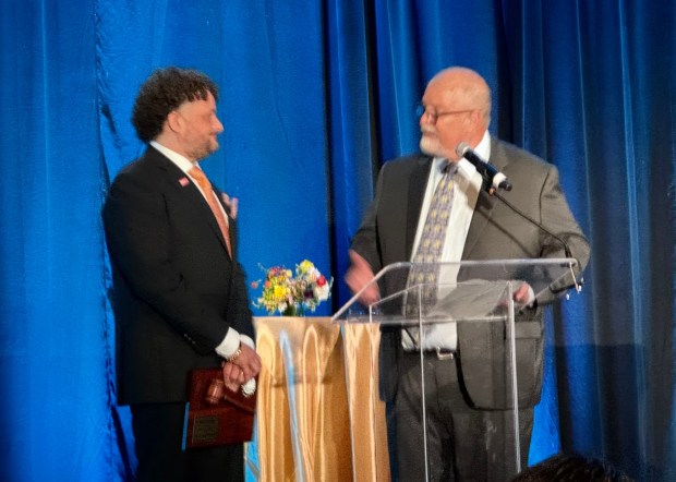Rob Lindo, left, who served as chair of the San Jose Chamber of Commerce in 2025, welcomes Ed Davis, the 2026 chair, at the chamber's Leaders and Legacy dinner, held at the Signia by Hilton hotel in downtown San Jose on Thursday, Feb. 26, 2026. (Sal Pizarro/Bay Area News Group)