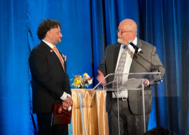 Rob Lindo, left, who served as chair of the San Jose Chamber of Commerce in 2025, welcomes Ed Davis, the 2026 chair, at the chamber's Leaders and Legacy dinner, held at the Signia by Hilton hotel in downtown San Jose on Thursday, Feb. 26, 2026. (Sal Pizarro/Bay Area News Group)
