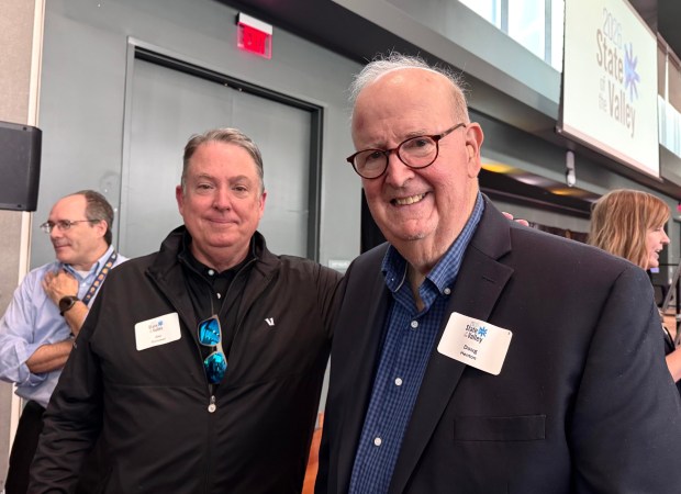 Jim Cunneen of California Strategies, left, stands with Doug Henton, who led the team that produced the first Silicon Valley Index in 1994 at the State of the Valley conference, held at San Jose State University on Friday, Feb. 27, 2026. (Sal Pizarro/Bay Area News Group)