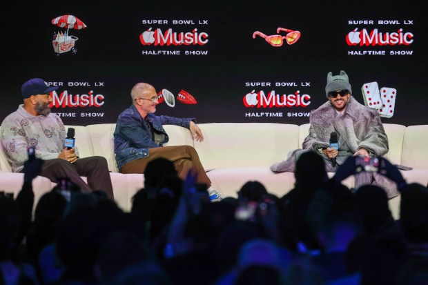 Apple Music Radio hosts Ebro Darden, left, and Zane Lowe interview Super Bowl Halftime Show superstar Bad Bunny during a Super Bowl LX pregame and Apple Music Halftime Show press conference at Moscone Center in San Francisco, Calif., on Thursday, Feb. 5, 2026. (Ray Chavez/Bay Area News Group)