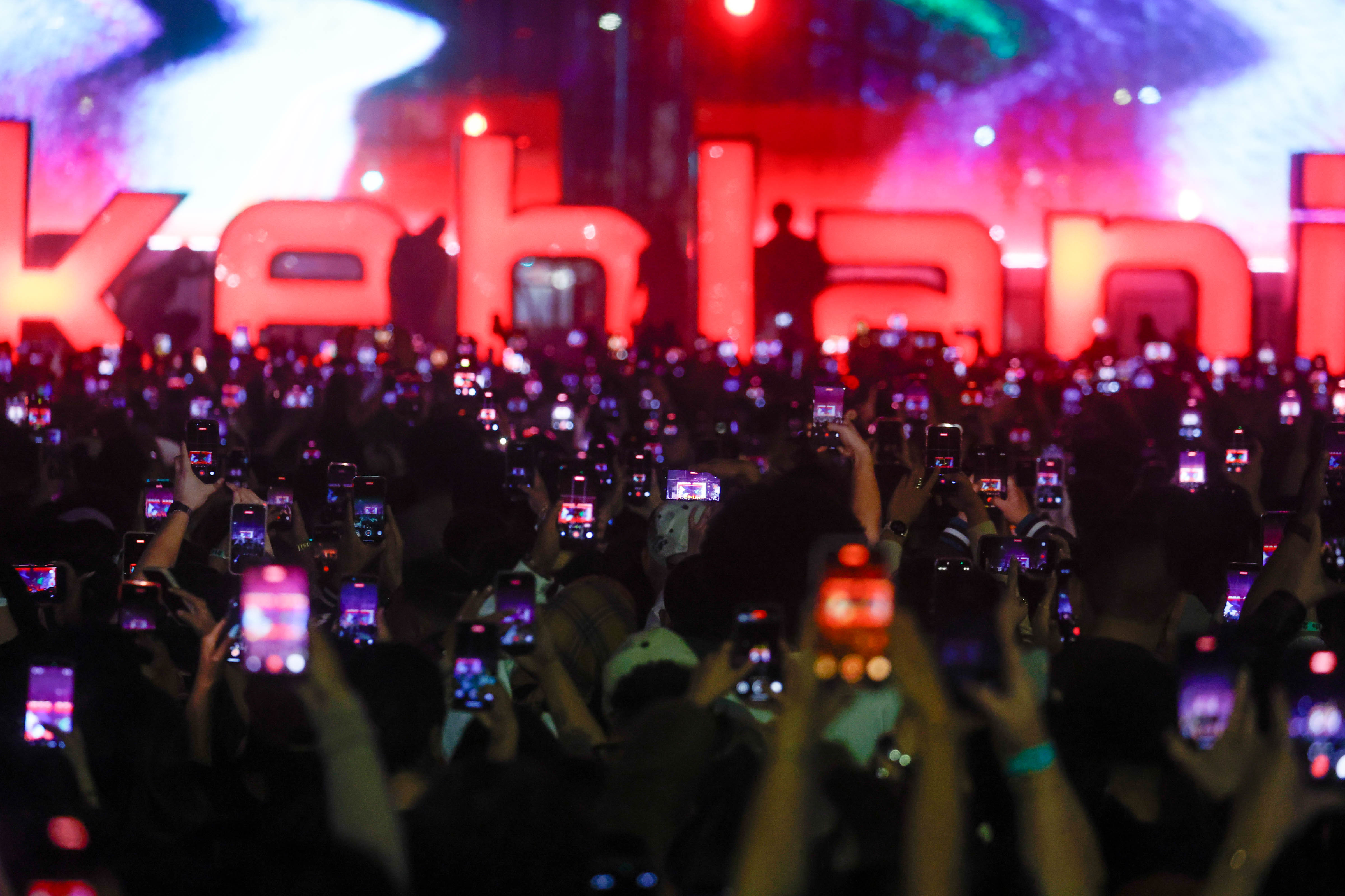 People record on their phones while Kehlani performs during the...