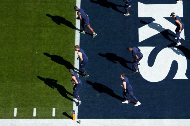 Seattle Seahawks players stretch before the NFL Super Bowl 60 football game against the New England Patriots, Sunday, Feb. 8, 2026, in Santa Clara, Calif. (AP Photo/Godofredo A. Vásquez)