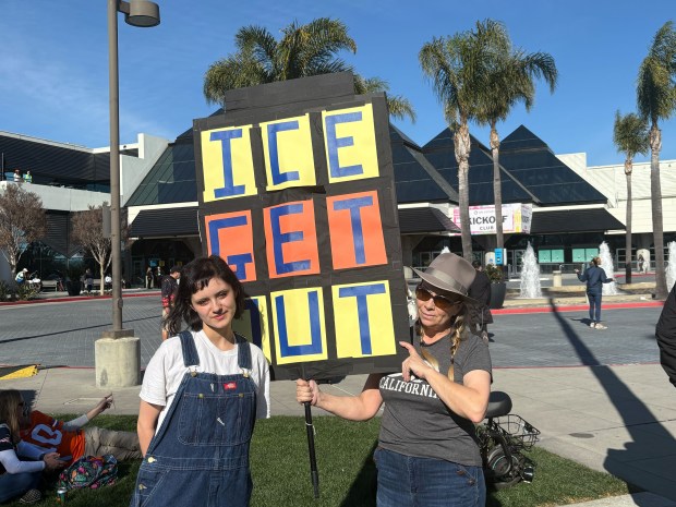 Tanya Bell, 54, and her daughter Beatrice Bell, 19, of Mountain View have been protesting ICE in front the of Santa Clara Convention Center for about two hours. Tanya said it was the best way for them to get their message out as Super Bowl 60 is soon getting under way at Levi's Stadium in Santa Clara, Calif., on Sunday, Feb. 8, 2026. (Grace Hase/Bay Area News Group)