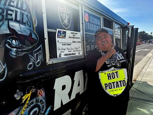 Andy Coronado, 62, of Stockton, has driven his Raiders bus to and from games since 2012 even when the team relocated to Los Vegas in 2020. He is outside the stadium at Super Bowl 60 at Levi's Stadium in Santa Clara, Calif., on Sunday, Feb. 8, 2026. (Grace Hase/Bay Area News Group)