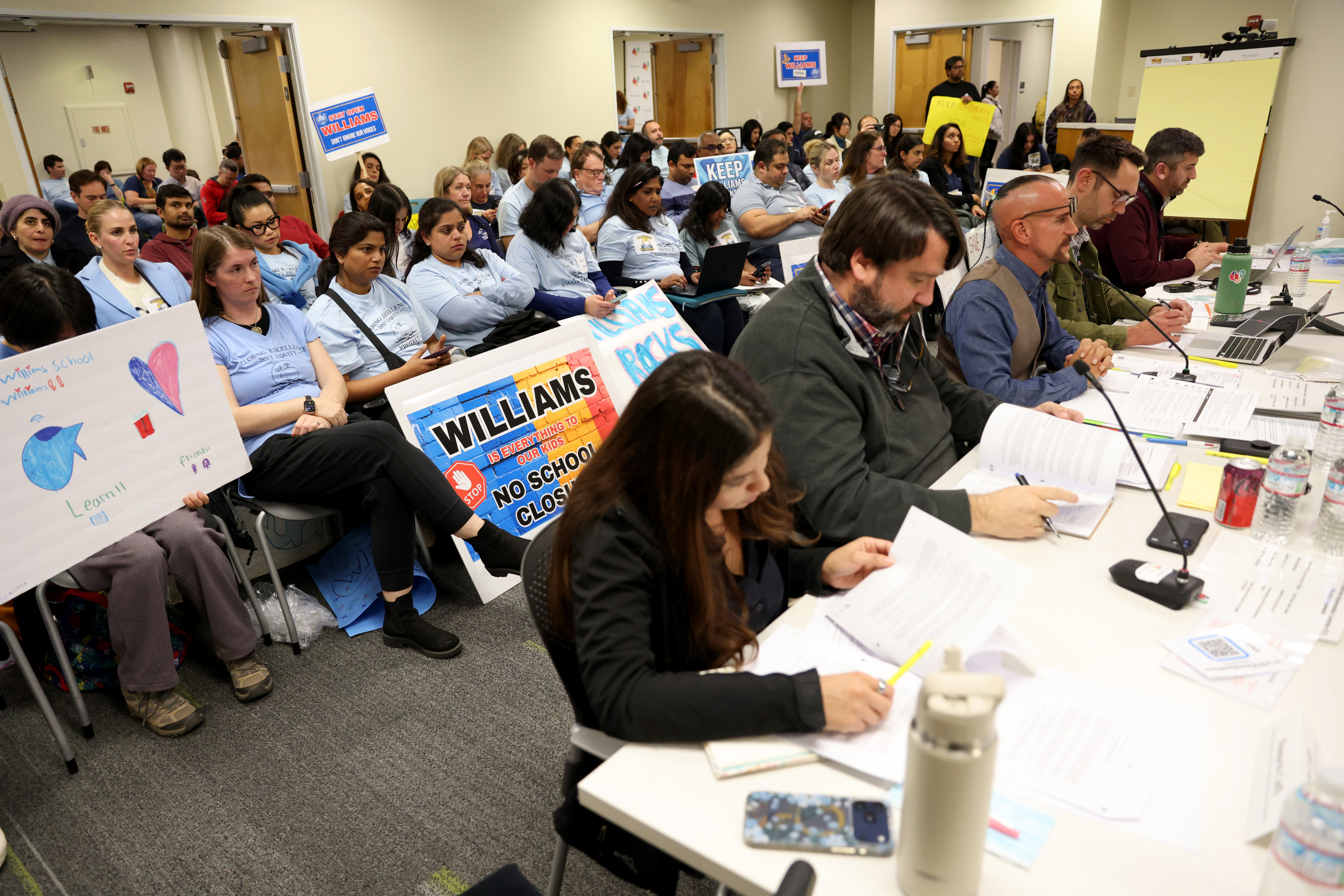 Community members attend a meeting at the San Jose Unified...
