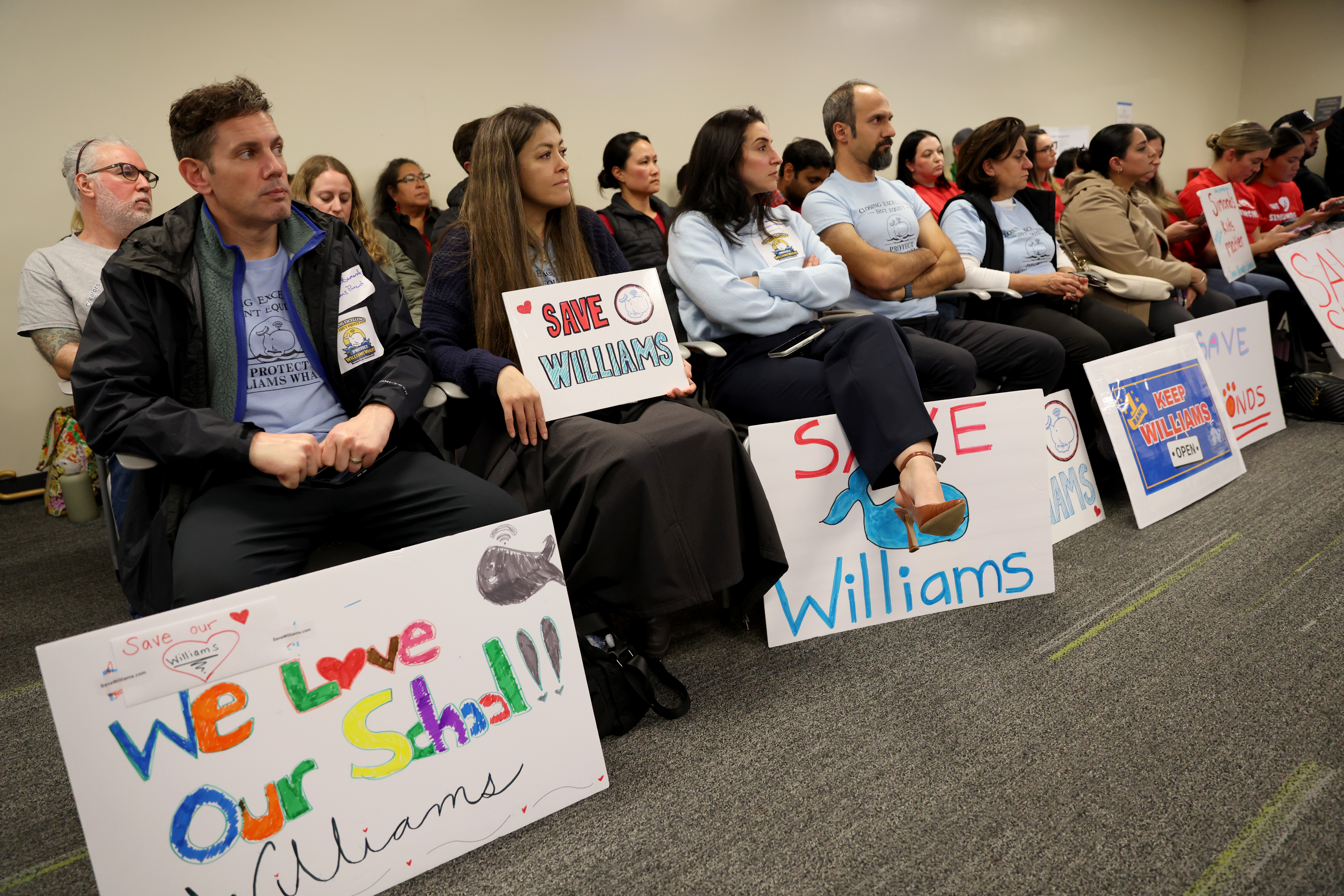 Community members attend a meeting at the San Jose Unified...