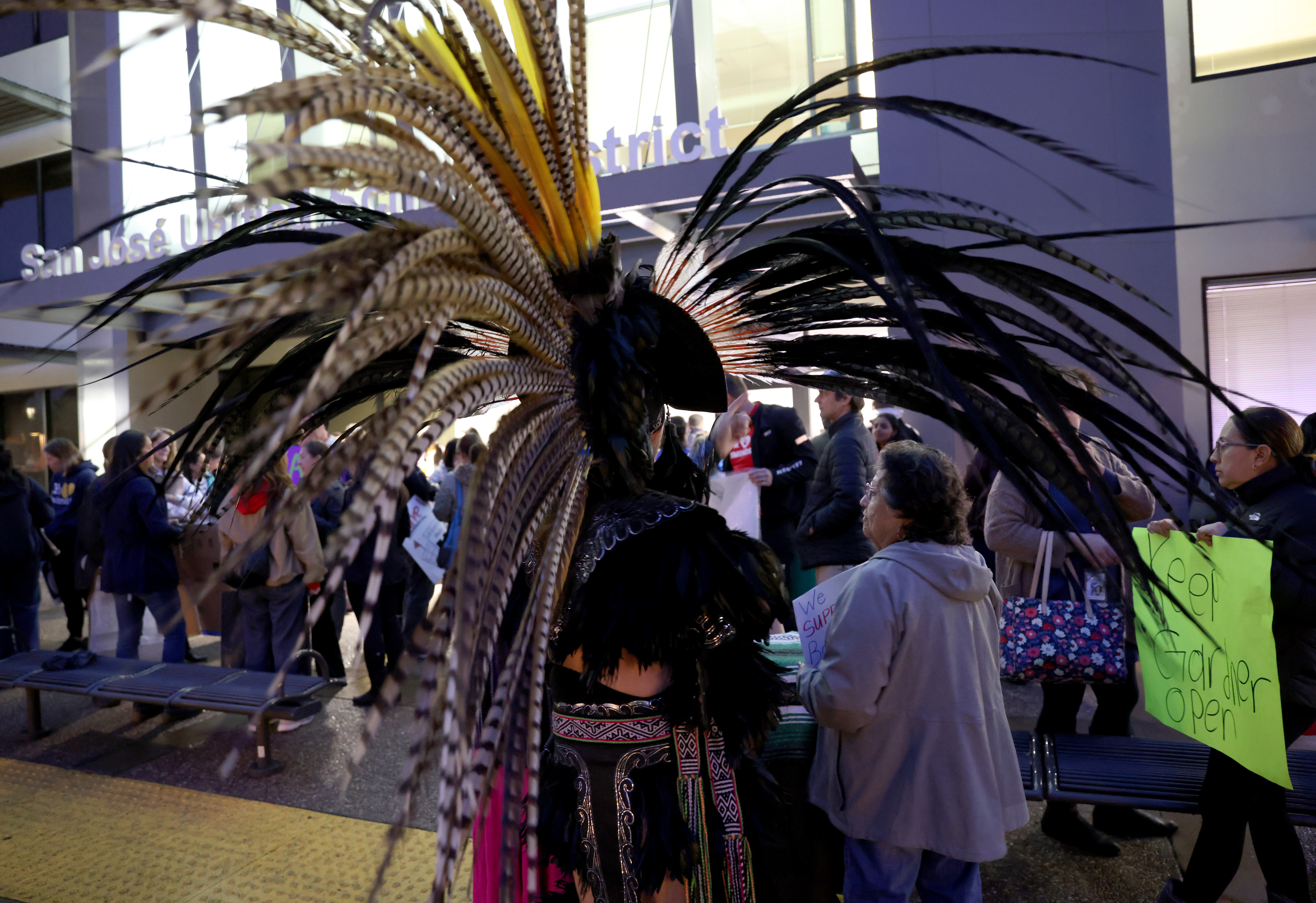 An Aztec dancer attends a meeting at the San Jose...