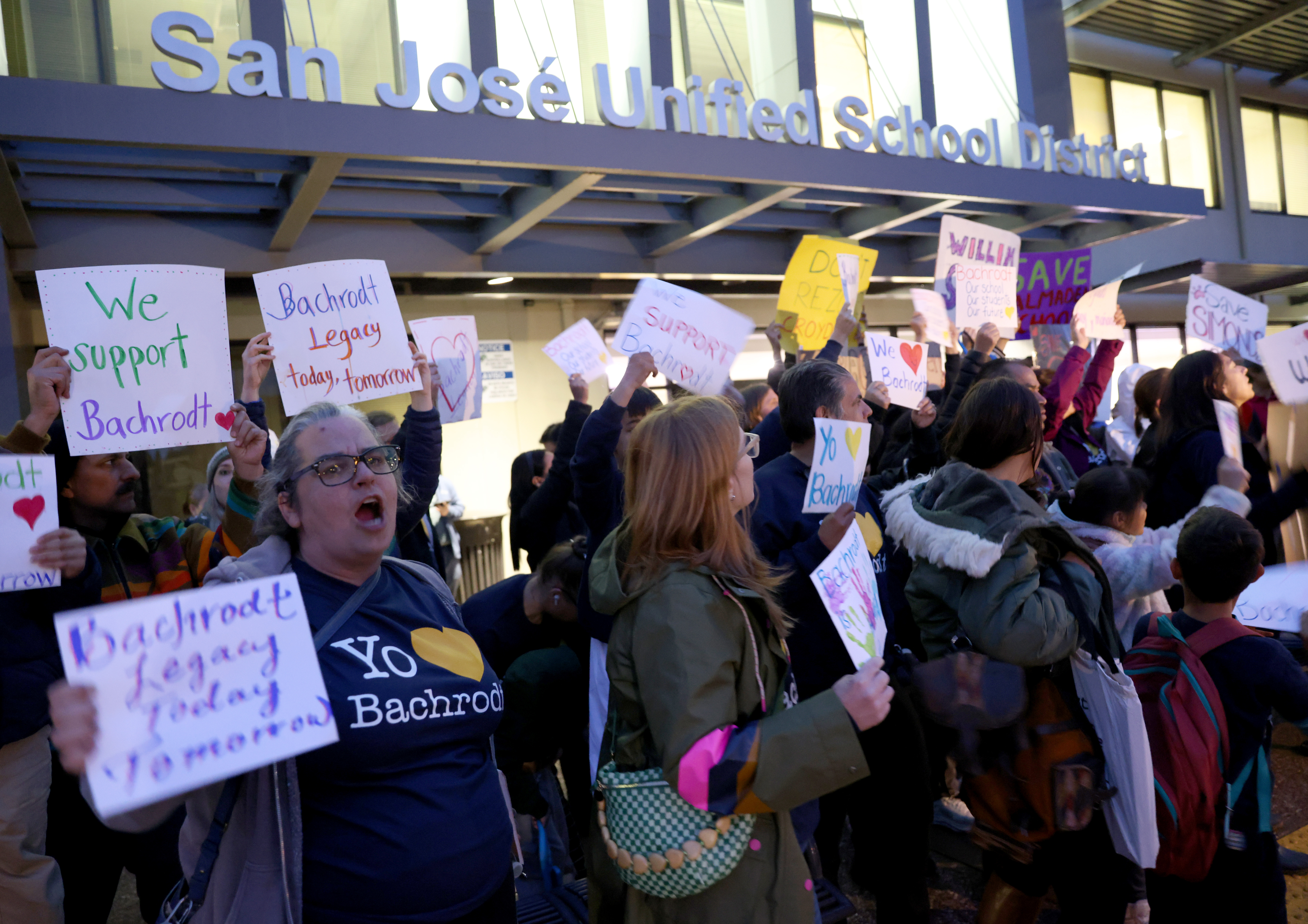 Parent Danielle Bouchard, left, and others, attend a meeting at...