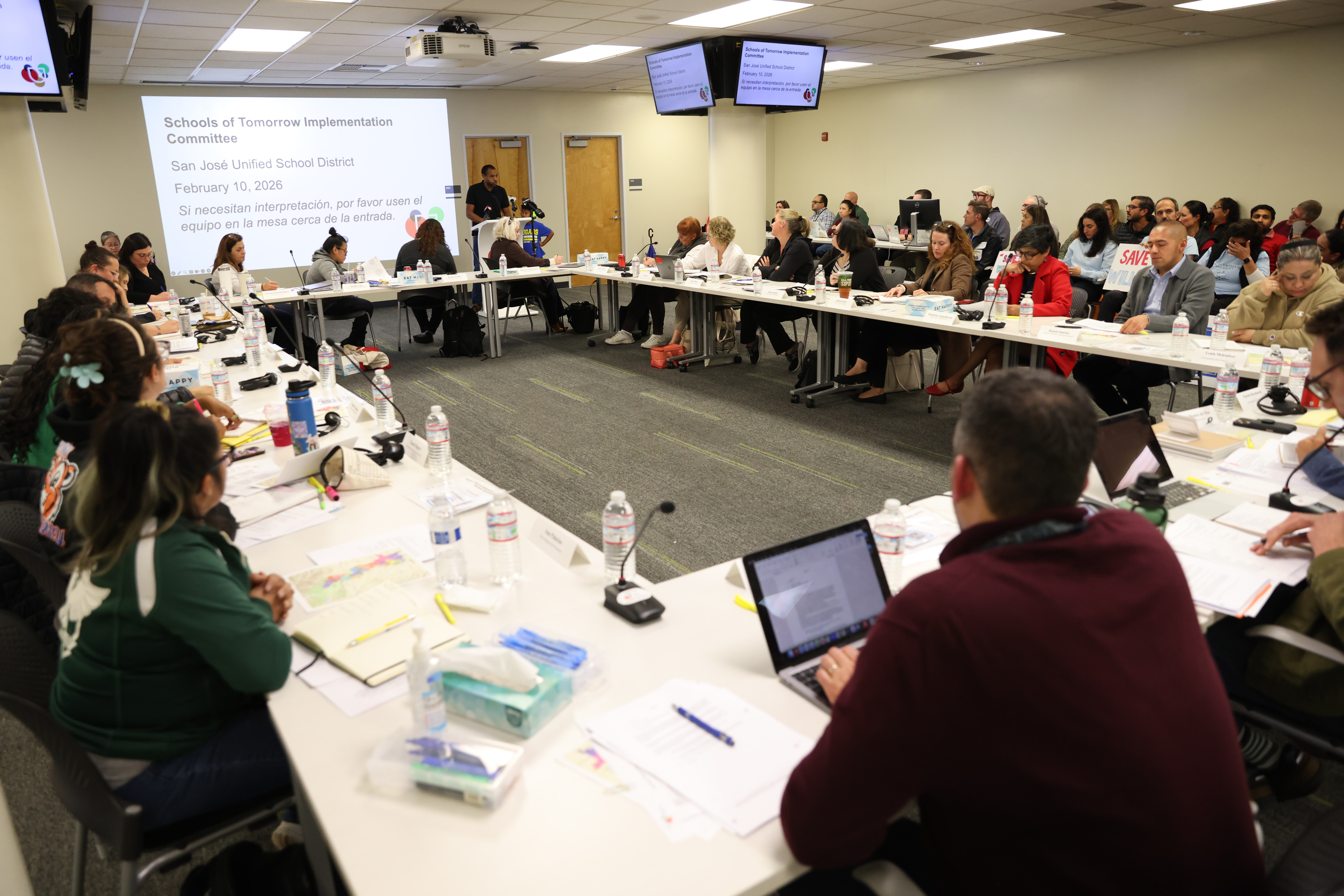 Community members attend a meeting at the San Jose Unified...