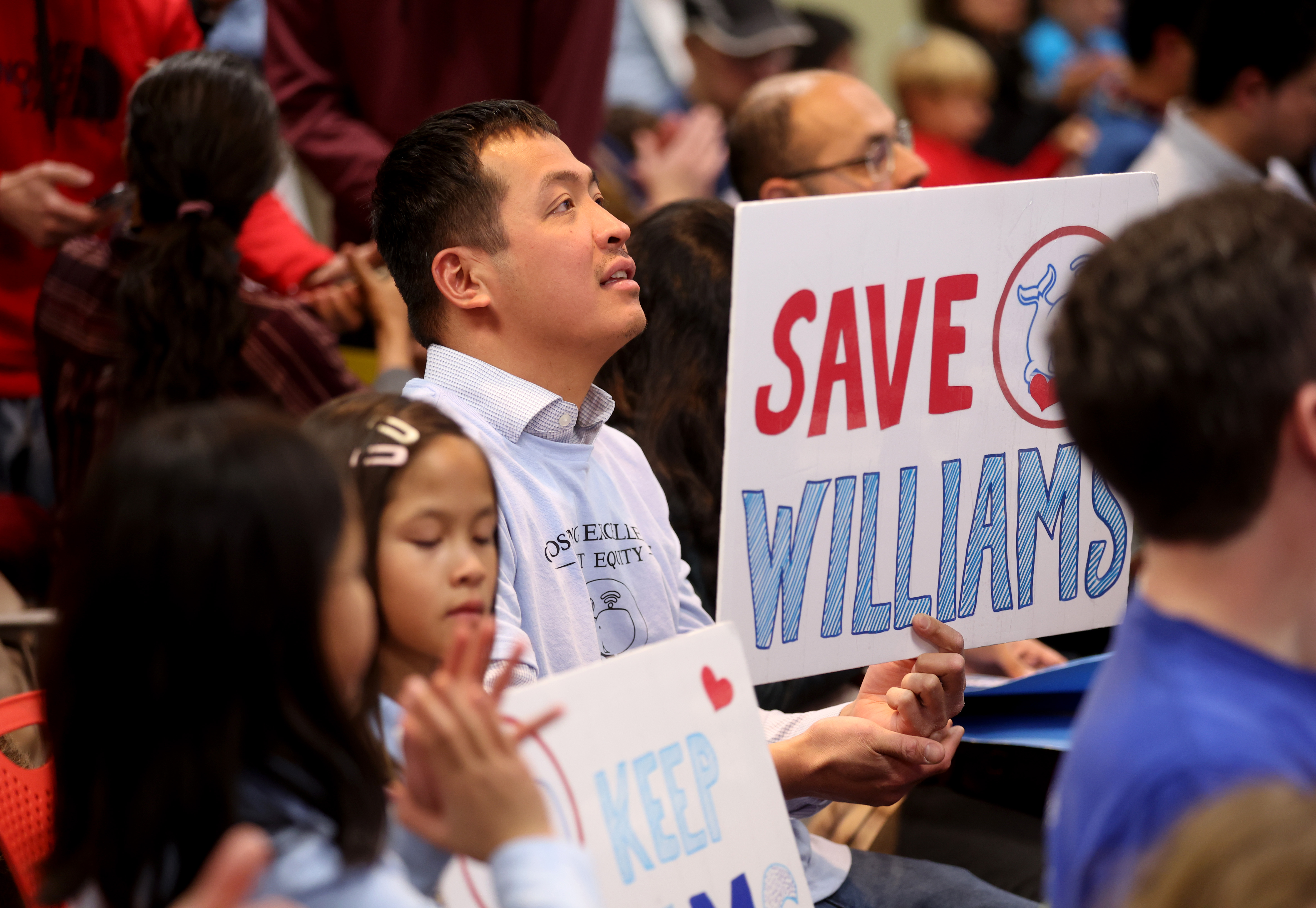 Community members attend a meeting at the San Jose Unified...