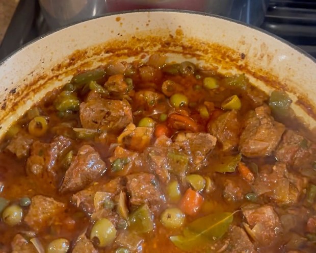 Chef Tanya Holland's Dominican pork guisado recipe yields a rich stew of marinated pork and vegetables, cooked slowly in a Dutch oven. (Courtesy Tanya Holland)