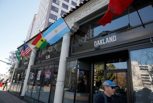 The Athletic Club Oakland is adorned with flag as they host a World Cup watch party of the United States men's national team's match against Iran in downtown Oakland, Calif., on Tuesday, Nov. 29, 2022. The U.S. beat Iran 1-0. (Jane Tyska/Bay Area News Group)