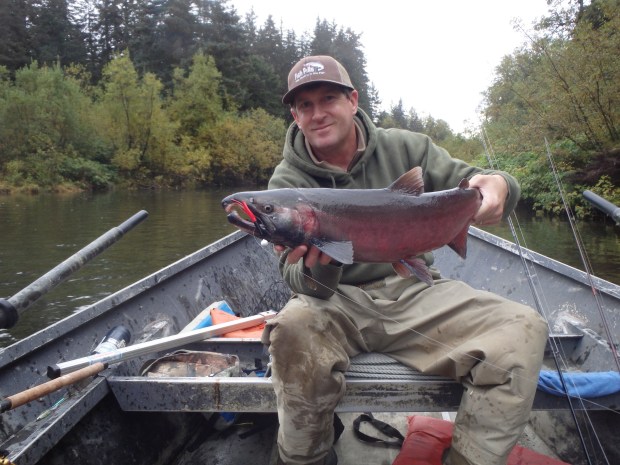 Santa Cruz angler Mike Baxter with a big silver salmon buck in spawning colors, pulled from the Situk River on a fishing trip to Yakutat, Alaska, in 2015. (Contributed)
