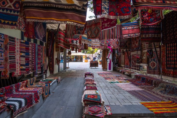 Vendors sell Armenian carpets near Tufenkian Historic Yerevan Hotel. (Benjamin Myers)