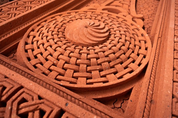 Rosettes and eternal knots on Armenian Khachkars (cross-stones) are intricately carved from volcanic tuff. (Benjamin Myers)
