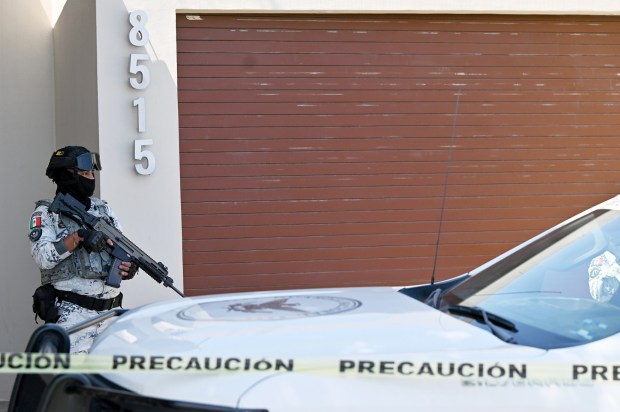 A member of the Mexican National Guard wards the house of Pablo Edwin Huerta NuÃ±o, alias "El Flaquito," the leader of the Arellano FÃ©lix cartel for more than 20 years and who has made alliances with the Jalisco Cartel, as well as with the two factions of the Sinaloa Cartel, hours after his early morning arrest at his Tijuana, Mexico home in the Fundadores neighborhood on Tuesday, June 17, 2025. (Carlos Moreno / The San Diego Union-Tribune)