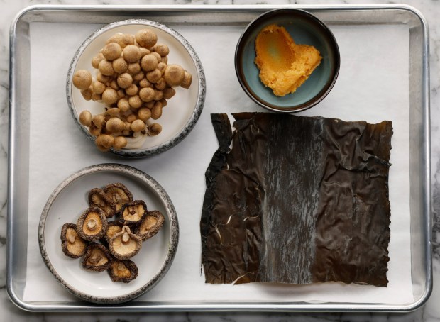 Ingredients for Miso Soup rely on first making a dashi stock: water, rehydrated shitake mushrooms, chopped scallion greens and kombu, edible kelp. (K.C. Alfred / The San Diego Union-Tribune)