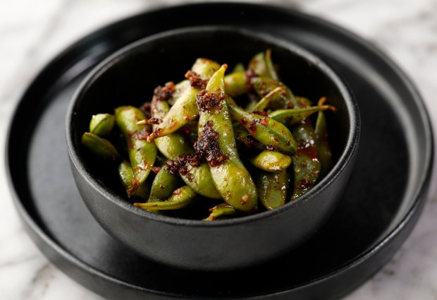 Edamame in Black Garlic Chili Crunch. (K.C. Alfred / The San Diego Union-Tribune)