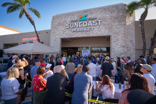 IMPERIAL BEACH, CA - JANUARY 31: Customers at SunCoast Market Co-op listen to speeches during the grand opening before the doors opened to the public for the first time, Saturday January 31, 2026, in Imperial Beach, California. It becomes only the second Co-op market to open in San Diego County, in the last 55 years. (Howard Lipin / For The San Diego Union-Tribune)