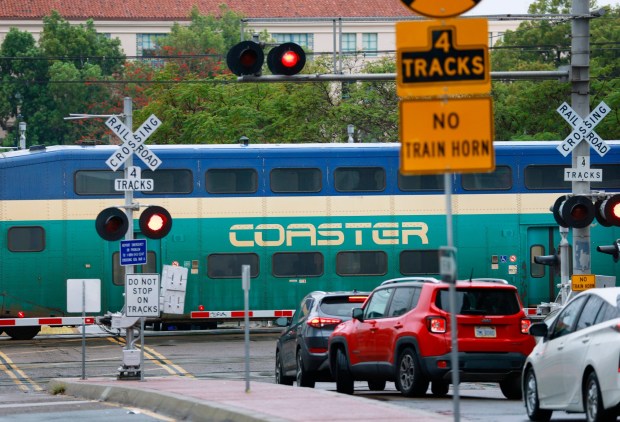 A Coaster commuter train heads north through downtown San Diego after departing from Santa Fe Depot on Feb. 11, 2026. (K.C. Alfred / The San Diego Union-Tribune)