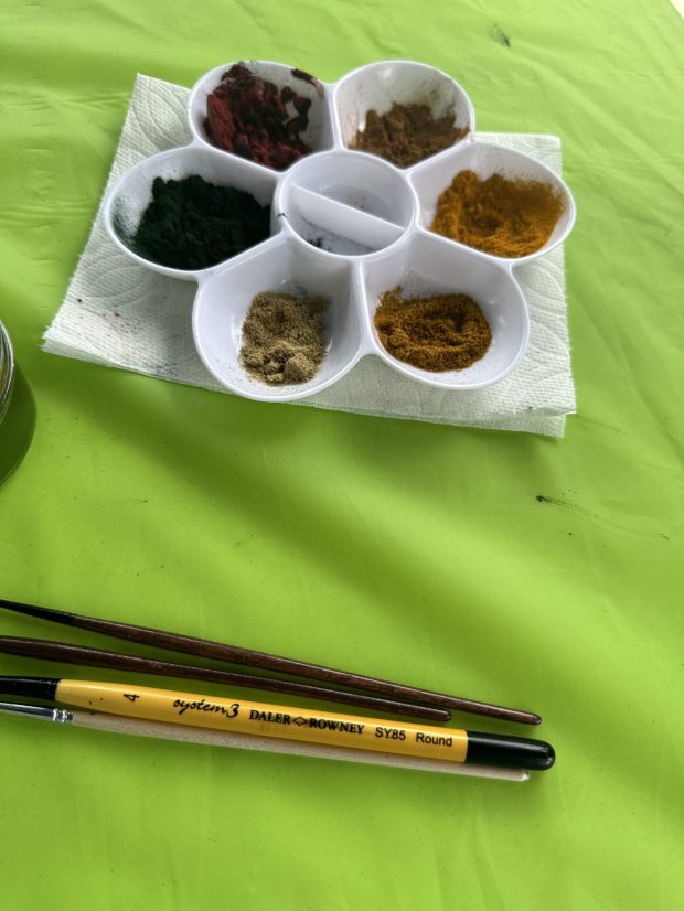 Simple supplies for creating art with spices - spices, a pallet tray or containers, a few brushes and water. (Jon Lewis)