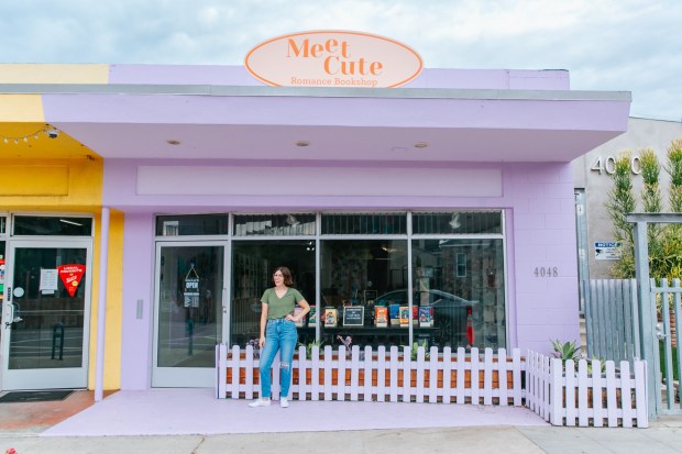Meet Cute Romance Bookshop founder Becca Title poses in front of the shop in North Park. (Robin Dayley)