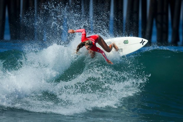 Avery McDonald competes during the first day of Super Girl Surf Pro competition at Oceanside Pier in September. (Meg McLaughlin / The San Diego Union-Tribune)