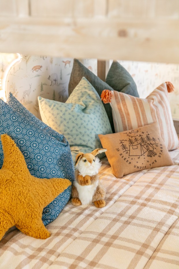 A cozy snuggle spot on the cabin bed. (Tracy Lynn Studio)