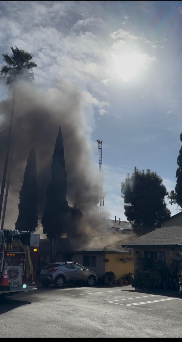 Firefighters put a stream of water on a fire at a San Marcos apartment building reported early Monday afternoon. (San Marcos Fire Department)