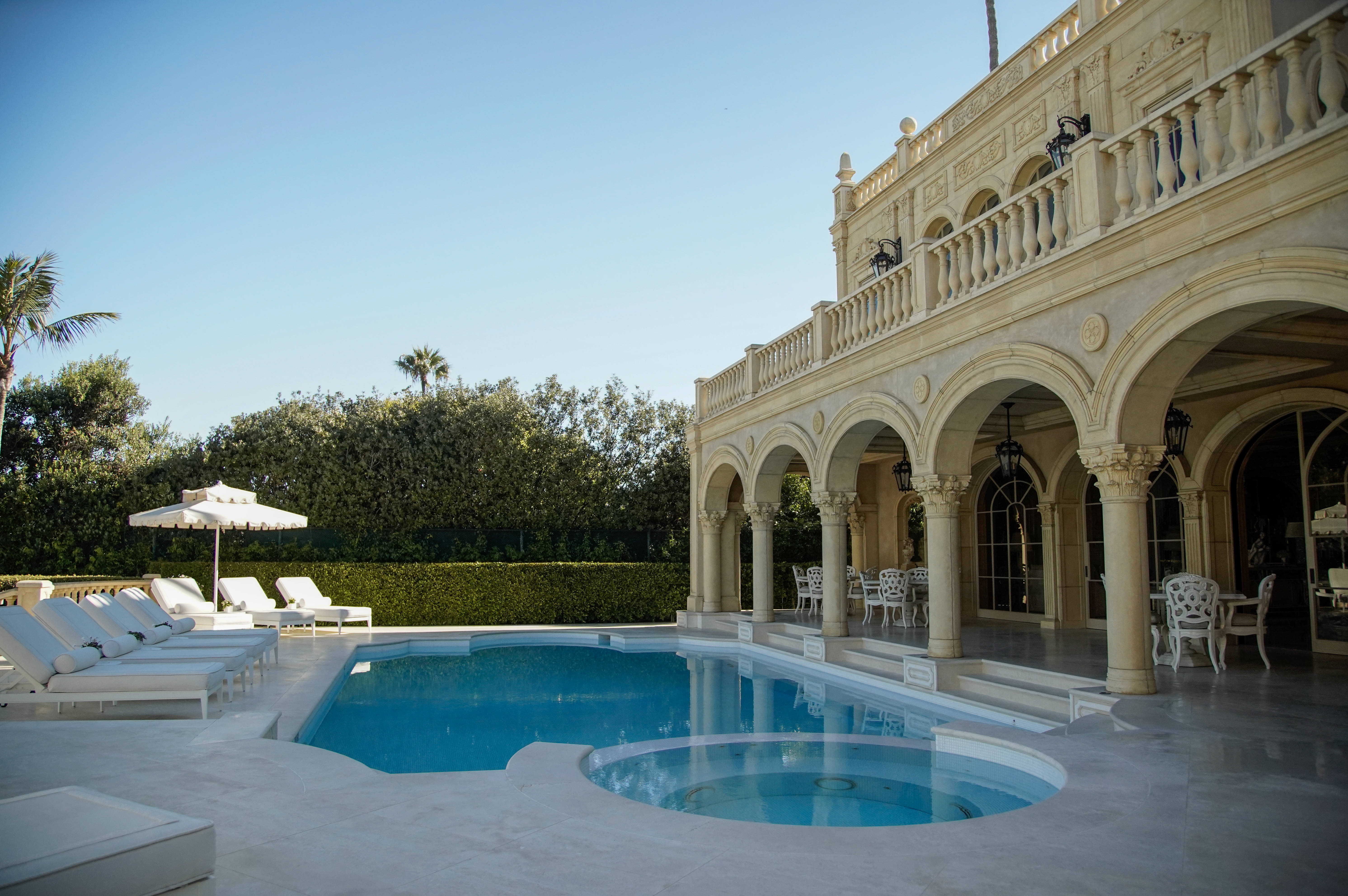 Pool area next to the guest house of the Sand...