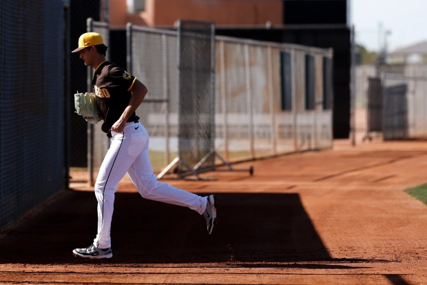 Kyle Hart #68 of the San Diego Padres runs to the next field during spring training workouts at the Peoria Sports Complex on Thursday, Feb. 12, 2026 in Peoria, Ariz.(Meg McLaughlin / The San Diego Union-Tribune)