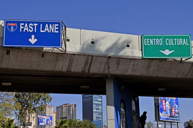 Mural Artist Gerardo "Mode" Orozco works on a mural dedicated to slain Tijuana photographer Margarito Martinez and Reporter Lourdes Maldonado called "The Truth Wall" located near San Diego's Fast Lane to the San Ysidro Port of Entry on Saturday, February 7, 2026. Mode said through the work of this mural he seeks to show people the dedication of what some journalists sacrifice to bring the news to us and seeks justice through the artwork for both Martinez and Maldonado, who were gun down at their homes in 2022 for doing their work as journalists. (Carlos Moreno / The San Diego Union-Tribune)
