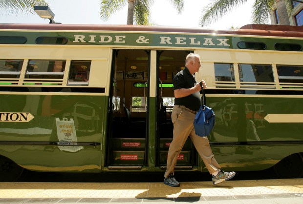 Dennis Graff, of Chula Vista, steps off a vintage trolley after riding it through downtown San Diego on Tuesday, May 28, 2014. (Stan Lim / PE file)