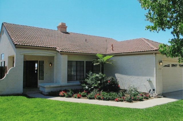 Before: The front yard is largely covered with grass, and...