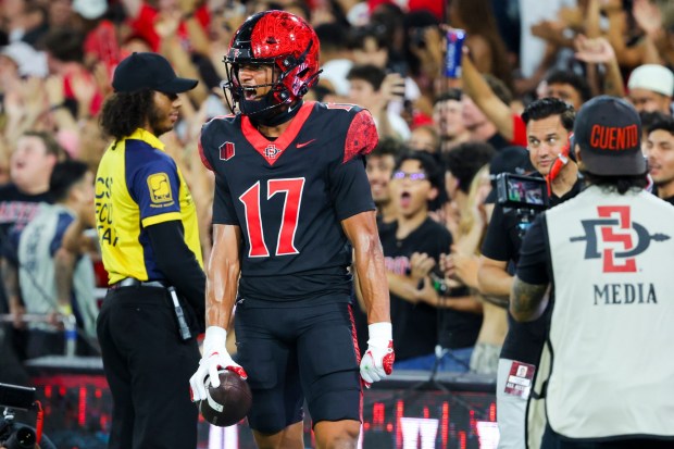 Jacob Bostick #17 of San Diego State celebrates after a touchdown against Stony Brook during the first half at Snapdragon Stadium on Thursday, Aug. 28, 2025 in San Diego, CA. (Meg McLaughlin / The San Diego Union-Tribune)