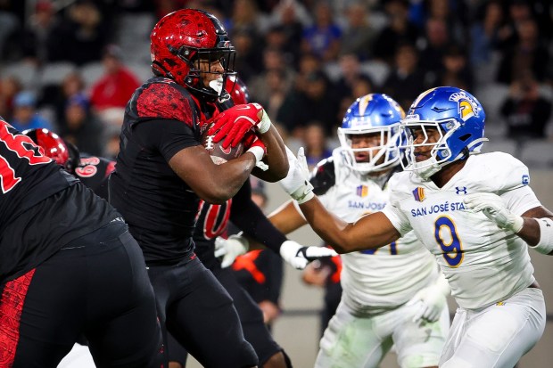 San Diego State's Lucky Sutton leads potent SDSU rushing attack. (Meg McLaughlin / The San Diego Union-Tribune)