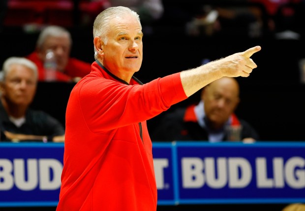 San Diego State coach Brian Dutcher and former coach Steve Fisher have been the school's only two men's basketball coaches in the Mountain West. (K.C. Alfred / The San Diego Union-Tribune)