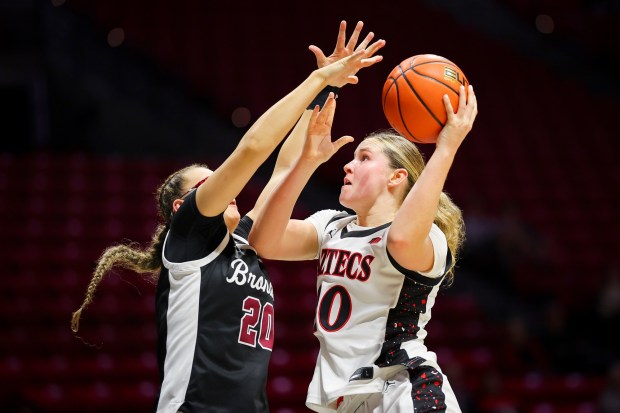 Bailey Barnhard #20 of San Diego State goes up for a shot against Delainey Miller #20 of Santa Clara during their game at Viejas Arena on Wednesday, Nov. 19, 2025 in San Diego, California. (Meg McLaughlin / The San Diego Union-Tribune)